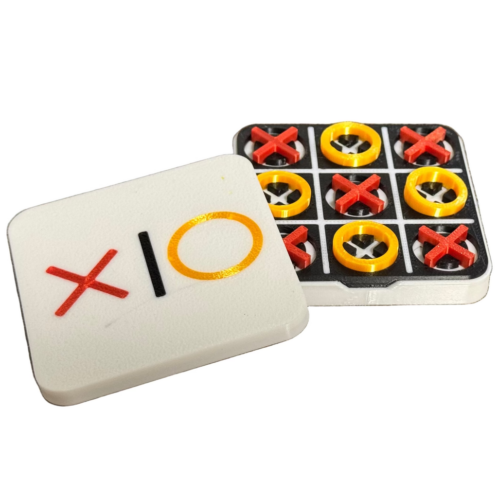Noughts and crosses game set with pieces on a white background