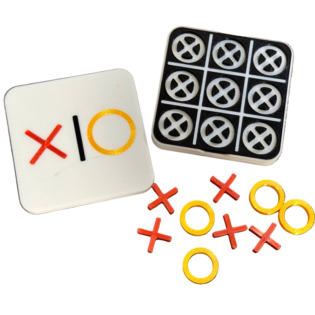 Noughts and crosses game with red 'X' and yellow 'O' markers on a metallic surface.